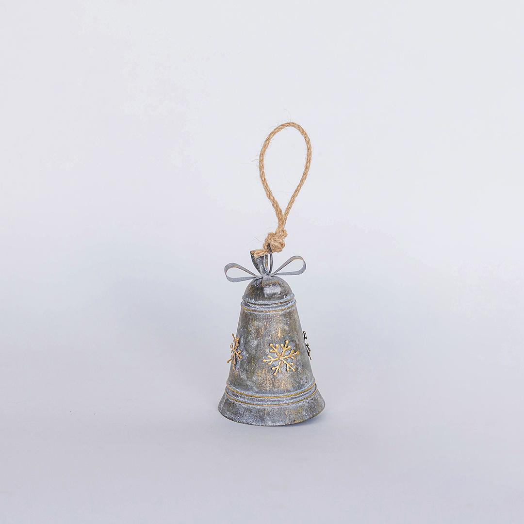 Decorative bell with snowflake designs on a white background