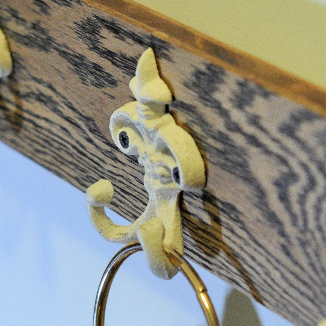 3 Vintage White Coat Hooks on a Wooden panel