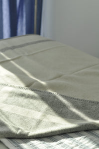 Close-up of a textured fabric surface with a blurred background