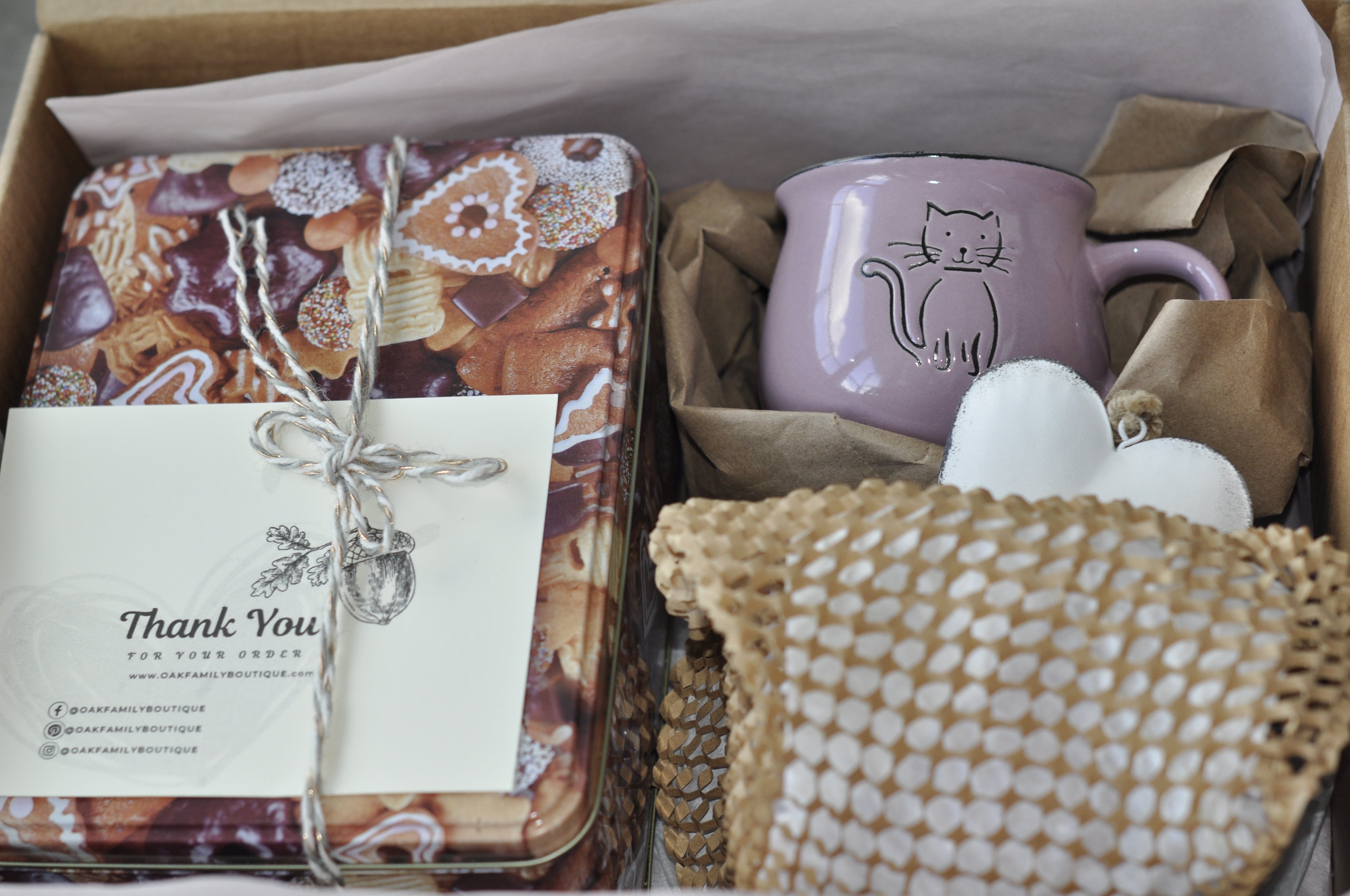 Gift set with a mug, tea towel, and card in a box