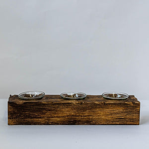 Wooden pet feeder with three bowls on a white background