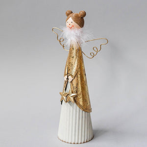 A decorative metal angel with golden hearts, wings, and a white base, wearing a golden robe.